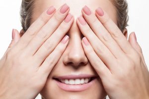 Woman's Hands Covering Eyes