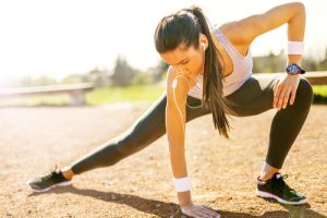 female runner stretching