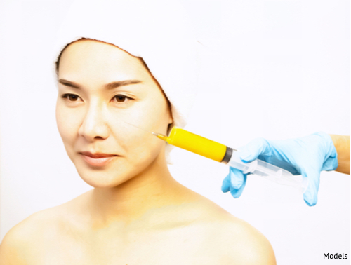 Face of beauty woman prepare for injection with stem cell syringe-img-blog